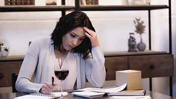 Women struggling to complete divorce paperwork.